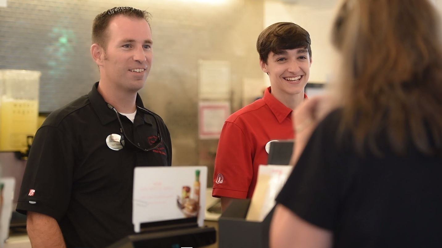 An officer and a Team Member | Chick-fil-A